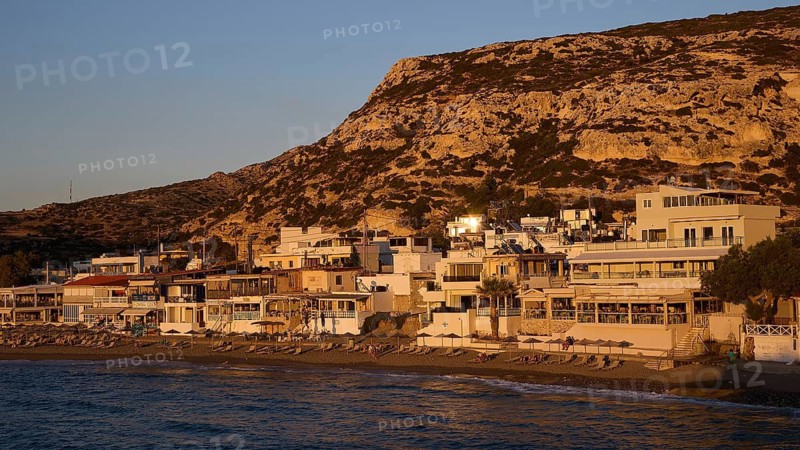 Coastal view with houses and hills, quiet atmosphere at sunset, Matala, South Coast, Crete, Greek Islands, Greece