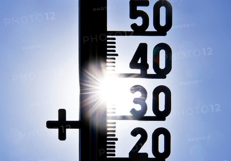 Thermometer shows heat in blazing sun and cloudless sky, symbolic image, summer 2026, Witten, North Rhine-Westphalia, Germany