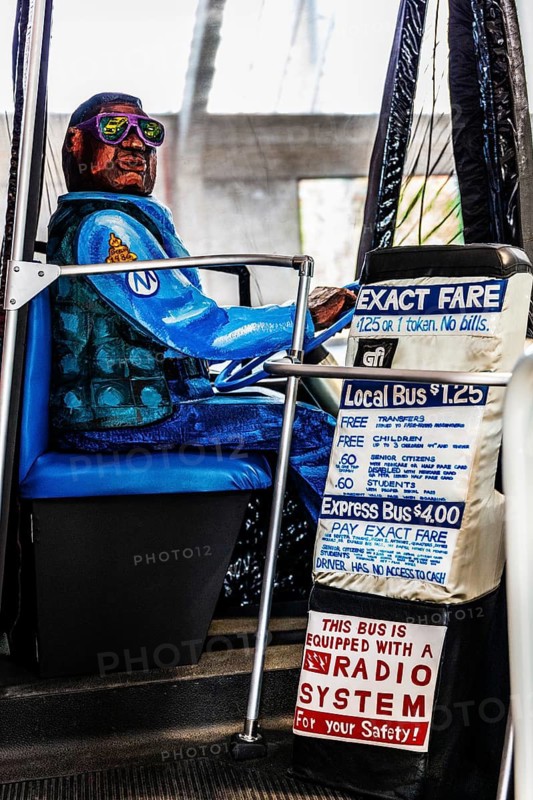 Sculpture The Bus by artist Red Grooms, depicting hectic city life with various passengers, FENIX, museum about migration, in a historic warehouse in Katendrecht, hub for overseas emigrants, Rotterdam, Netherlands