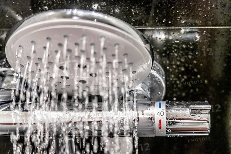 Shower, fitting, temperature control, temperature control of the shower water