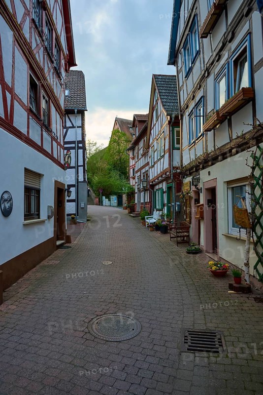 Narrow street with traditional half-timbered houses and a cozy atmosphere, spa town of Bad Orb, Spessart nature park Park, Main Kinzig district, Hesse, Germany