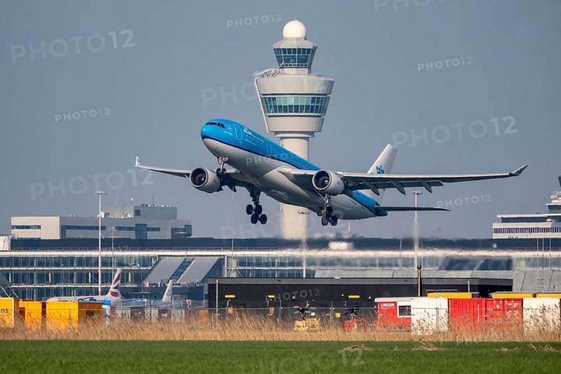 KLM aircraft takes off from Kaagbaan runway, 06/24, at Amsterdam Schiphol Airport, AMS, Air Traffic Control Tower, the Netherlands