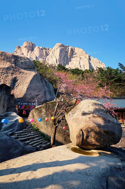 SEORAKSAN, SOUTH KOREA, APRIL 15, 2017: Kyejoam Seokgul Hermitage shrine and Ulsanbawi rock in Seoroksan National park, South Korea
