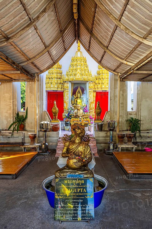 Spiritual temple interior and artfully designed altar, Buddhist temple complex Wat Paramai Yikawat, Koh Kret river island, Bangkok, Thailand