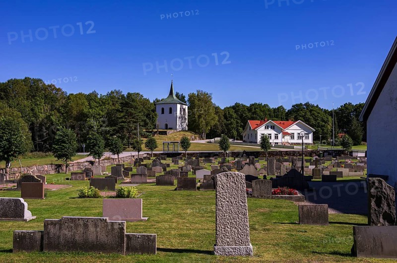 Free-standing bell tower from 1673 and cemetery of Skee kyrka, a church dating back to the 12th century in the village of Skee, near Strömstad in Bohuslän, Västra Götalands län, Sweden