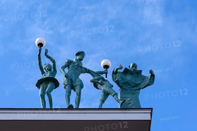 Figures on the roof of the Dille & Kamille department store, formerly a theatre, Enschede, the Netherlands