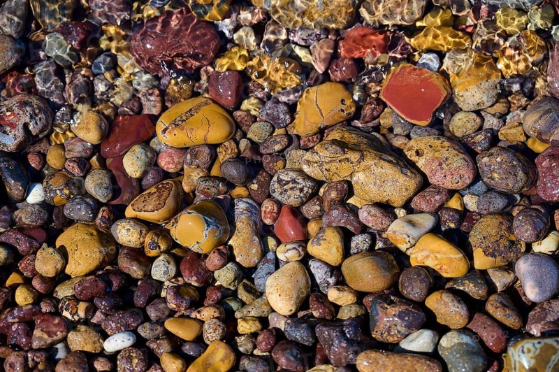 Varied colourful pebbles under water, whose colours and textures blend into nature, Lambi beach, pebble beach, Patmos, Dodecanese, Greek Islands, Greece