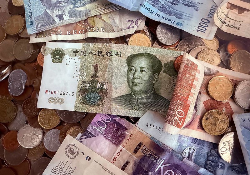 Detailed view of banknotes and coins from various countries as donations to preserve the UNESCO World Heritage Site, Bremen, Germany