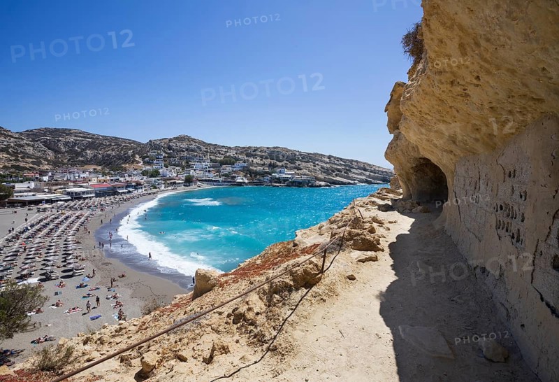View from the rock caves to the beach of Matala, south coast, Crete, Greece