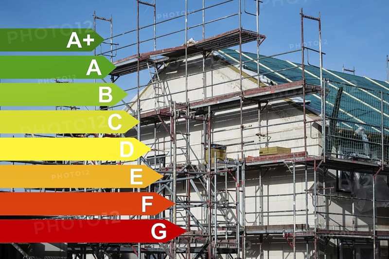 Scaffolding in front of a new insulated detached house, graphics with energy efficiency classes according to the GEG, Wuppertal, Germany