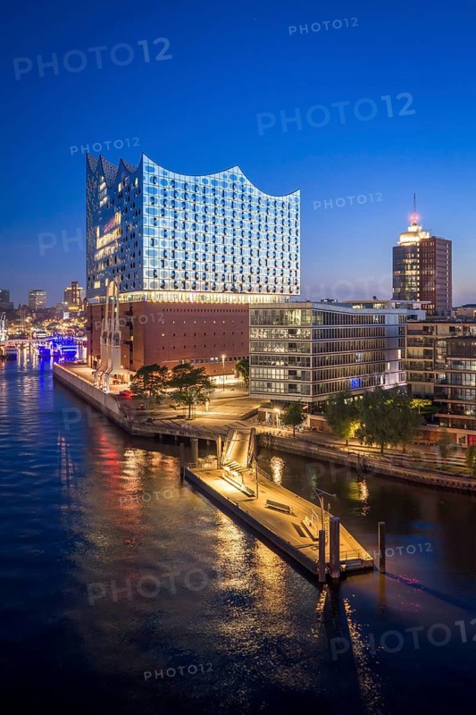 Aerial view of sunrise on the Elbe with Elbe Philharmonic Hall and reflections in the glass façade, Hamburg, Germany