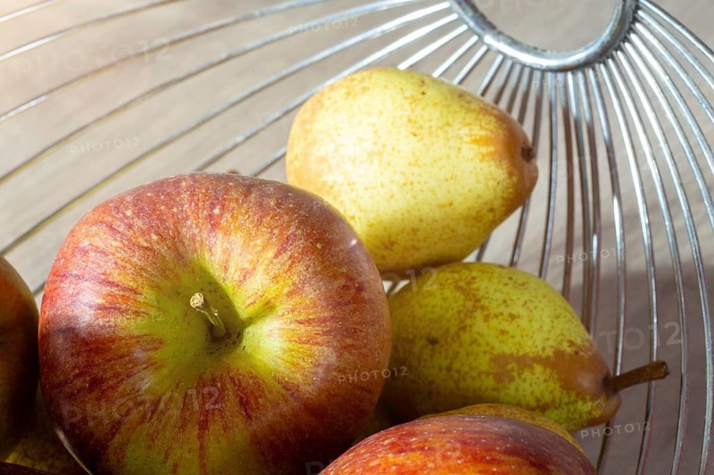 Close-up of apples and pears in the fruit basket