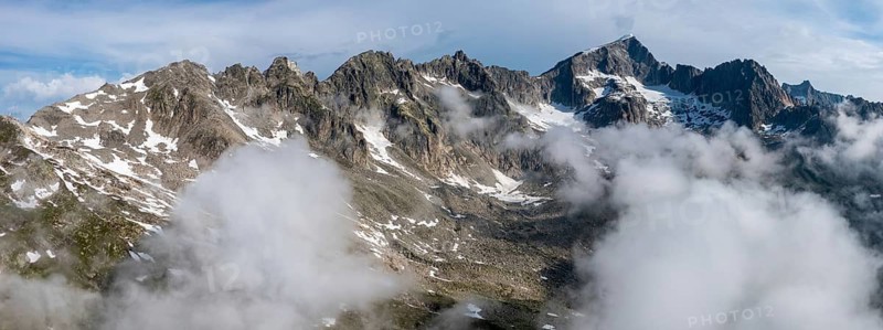 Mountain landscape with clouds of fog, Valais, Switzerland
