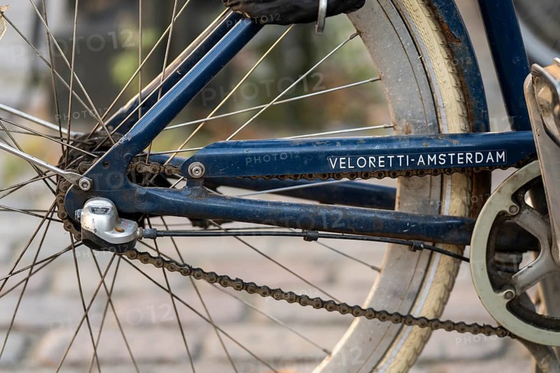 Close-up of a blue bicycle frame with the brand name Veloretti-Amsterdam and rear wheel, Nørreport, Copenhagen, Denmark