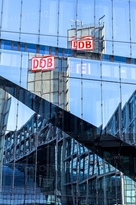 Reflection of the main railway station of DB Deutsche Bahn in a building facade in Berlin, Germany