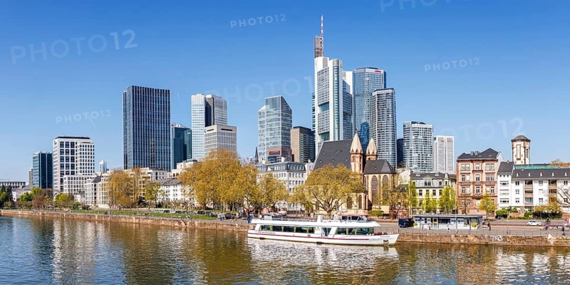 Frankfurt skyline skyscrapers with banks panorama at the river Main with excursion boat in Frankfurt, Germany