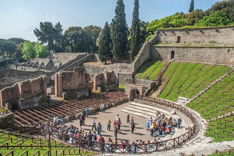 Tourists in amphitheater in the archaeologic site of Pompei, UNESCO World Heritage Site, province of Naples Campania, Italy, Southern Europe