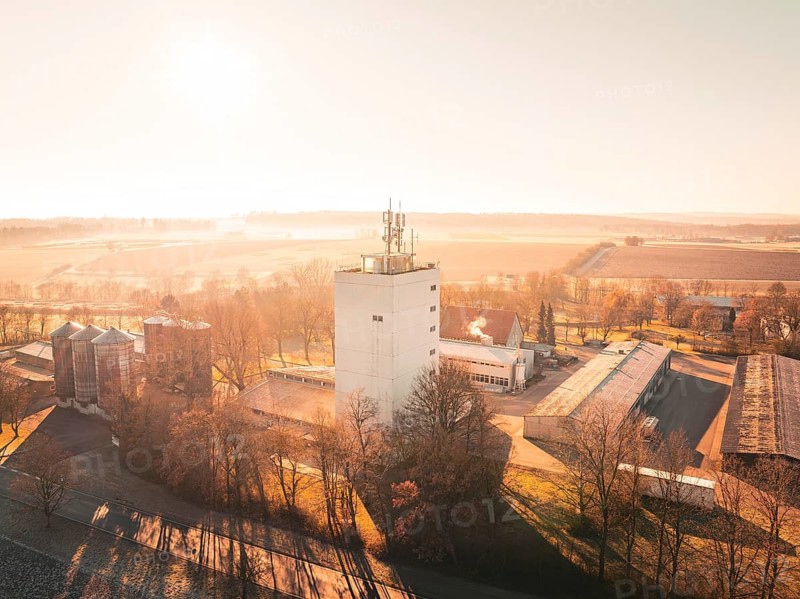 Industrial hall in a rural setting at sunset, surrounded by fields, Agricultural Experiment Station, Magstadt, Germany