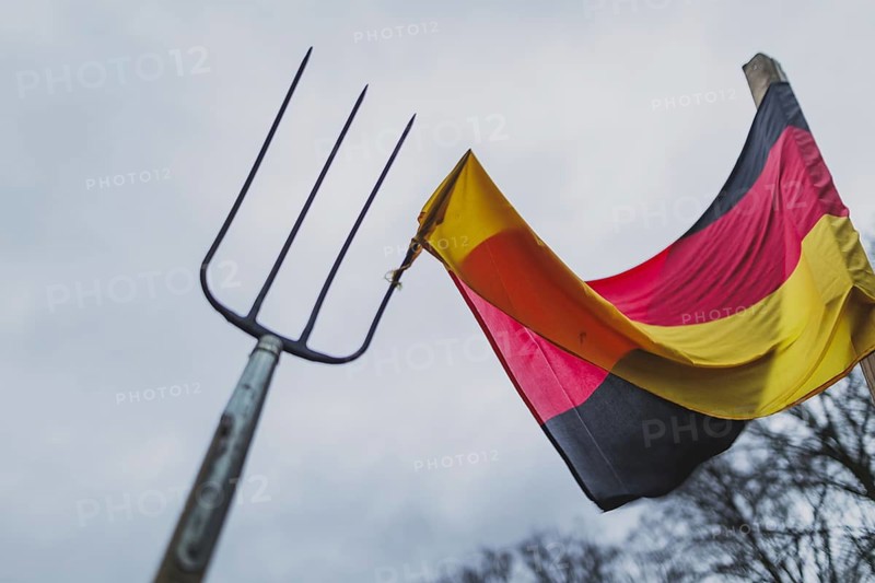 A pitchfork pierces the German flag, taken during the farmers' protests in Berlin, 15 January 2024. 10, 000 participants are expected on Monday as part of the farmers' protest week. Among other things, they are protesting against