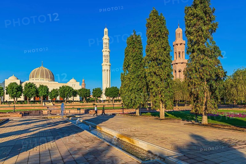 Park of the Sultan Qaboos Mosque, behind the mosque with the domes and minarets, Muscat, Arabian Peninsula, Sultanate of Oman