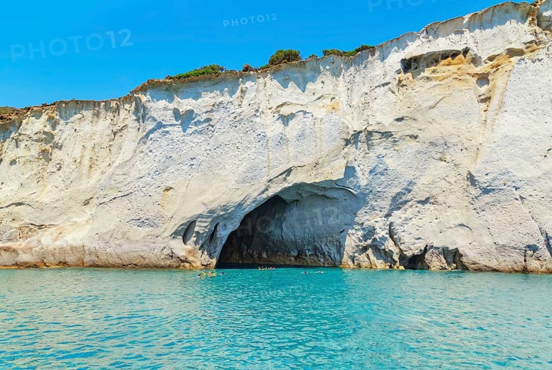 People swimming near sea cave, Kleftiko, Milos Island, Cyclades Islands, Greece