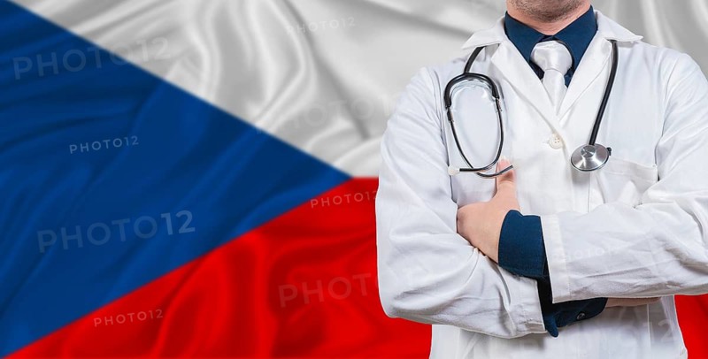 Male doctor with stethoscope on Czech Republic flag. Doctor holding stethoscope on Czech Republic flag