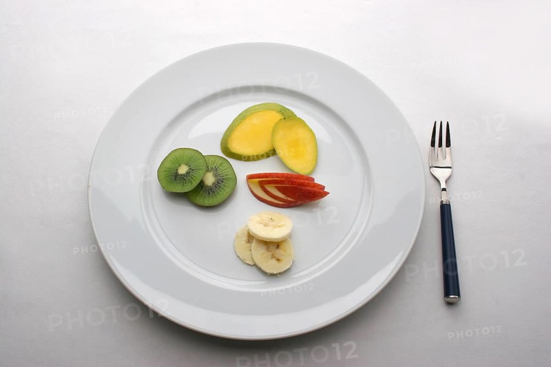 Fruit plate with kiwi, bananas, cucumbers
