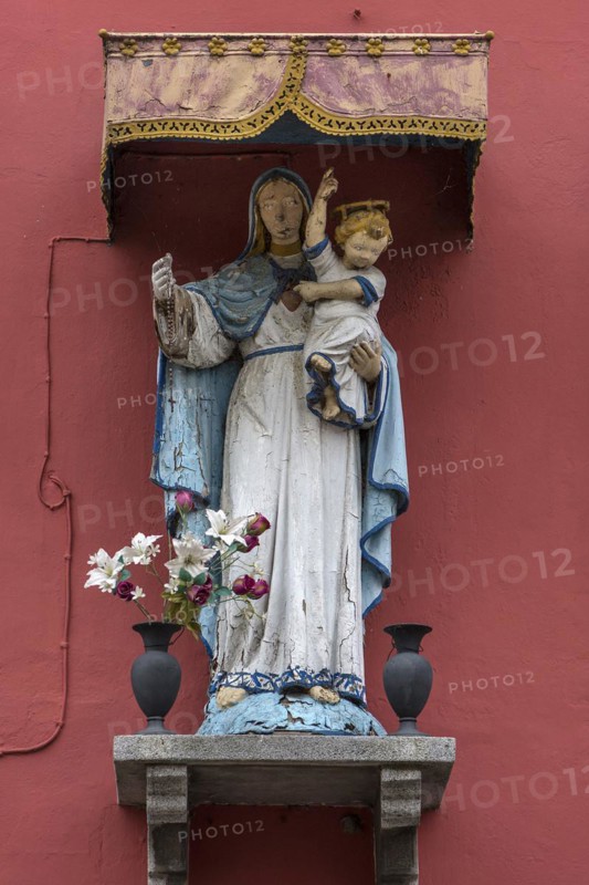 Sculpture of the Virgin Mary with the infant Jesus under a canopy, Burano, Veneto, Italy