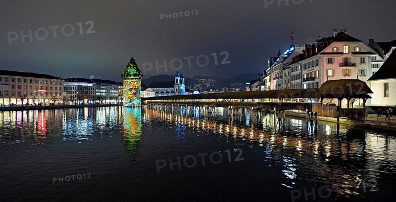 Wassertum with light installation, Chapel Bridge on the right, Jesuit Church on the Reuss at dusk behind, Old Town, Lilu, Light Festival 2025, Lucerne, Canton of Lucerne, Switzerland