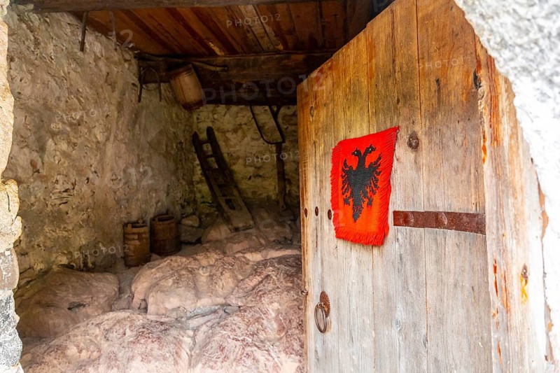 Entrance gate to Nikoll Koçeku tower in the valley of Theth national park, Albania. albanian alps