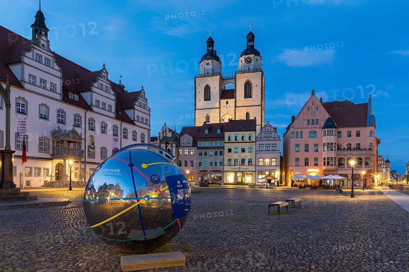 Atmospheric night view of market square with city church and old town hall, Luther city Wittenberg, Saxony-Anhalt, Germany