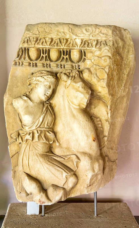 Fragment of Roman carved marble sarcophagus, female amazon on battle horse, archaeology museum, Apollonia Archaeological Park, Albania 2nd century AD