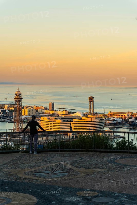 View of the old harbour and the city of Barcelona in the evening light, Spain