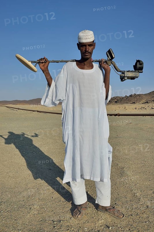 Gold seeker with metal detector, near Abu Sara, Nubia, Sudan