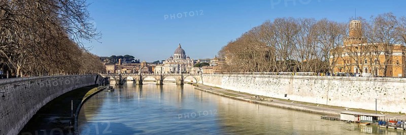 Rome skyline with St Peter's Basilica in the Vatican Panorama Ponte Sant'Angelo bridge over the river Tiber in Rome, Italy