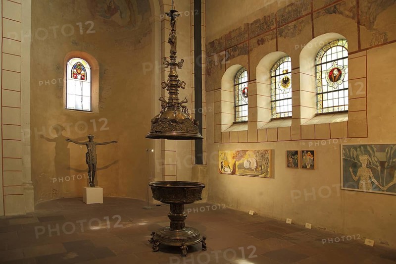 Baptism font of the Romanesque market church of St. Cosmas and Damian, stained-glass window with coat of arms and paintings, interior view, Goslar, Harz, Lower Saxony, Germany