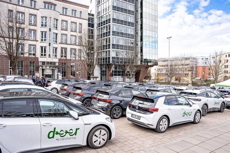 Cars in a parking lot surrounded by multi-storey buildings in the city, Deer, E-Carsharing, Stuttgart, Germany