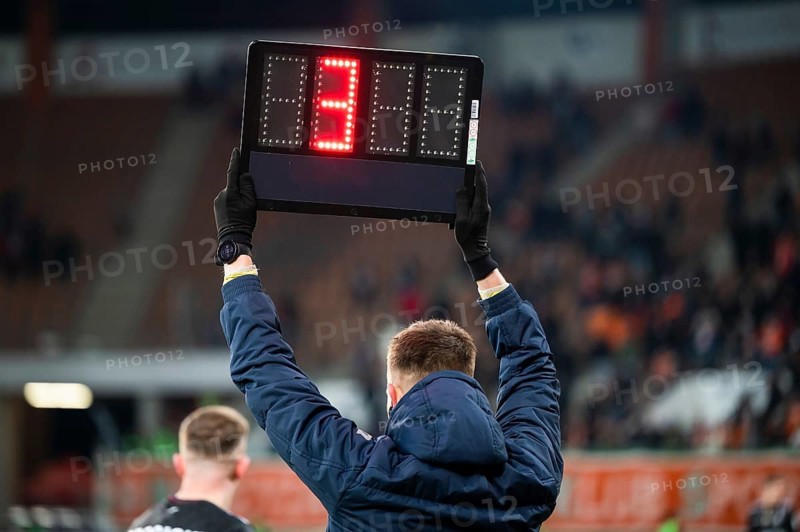 Sideline referee shows 4 minutes added time during the football match in Lubin, Poland