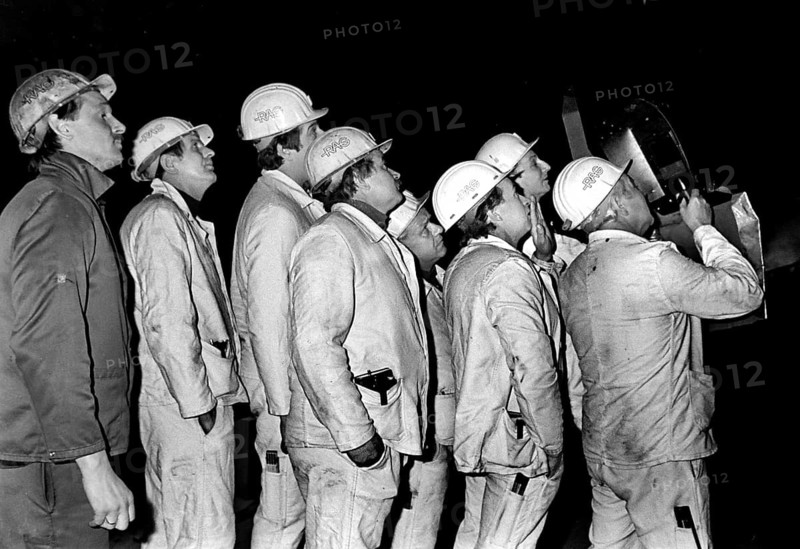 Essen, DEU, 17.11.85 - A worker and climber from the Zollverein coking plant, inspecting a coke oven. The coking plant was discontinued in 1993. Together with Zollverein Colliery, the former coking plant was declared a World Heritage Site by UNESCO in 2001, Essen, Germany