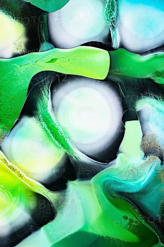 An intricate abstract pattern featuring vivid swirls of green, teal, and white. The liquids like texture and vibrant hues evoke movement and energy, perfect for modern designs and backgrounds