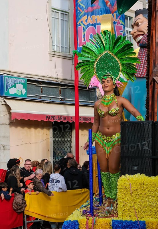 Loule, Algarve, Portugal - Loulé Carnival. With over 100 years of history, the carnival in Loule is the oldest carnival celebration in Portugal. Every year since 1906, the town of Loulé in the Algarve has been transformed into a colourful festival site that attracts thousands of visitors. A special feature of the carnival are the elaborately decorated floats. Each float is adorned with handmade paper flowers that symbolise the almond blossom of the Algarve