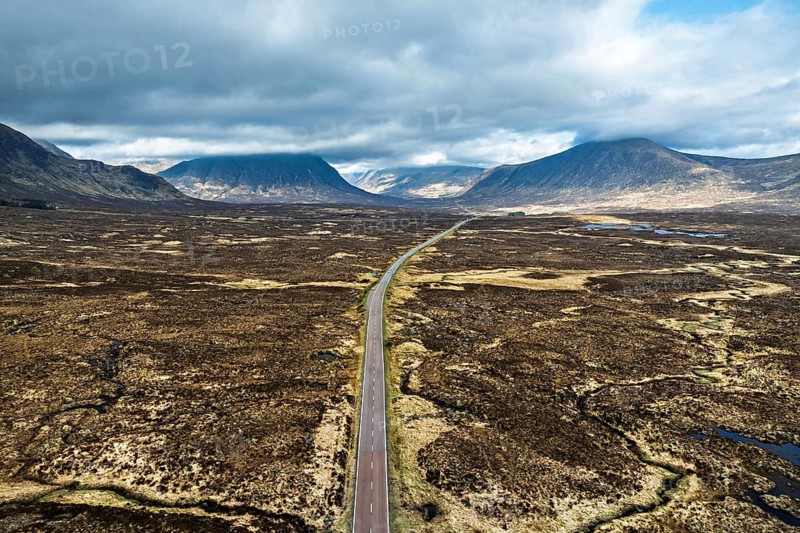 Moors and Road A82 over Glencoe Valley from a drone, Highland, Scotland, United Kingdom