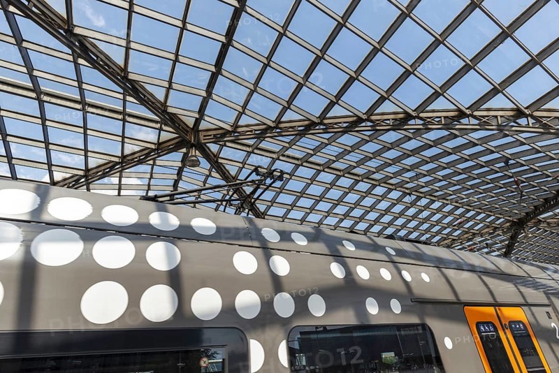 Local train and glass roof at Cologne Central Station, Cologne, Rhineland, North Rhine-Westphalia, Germany