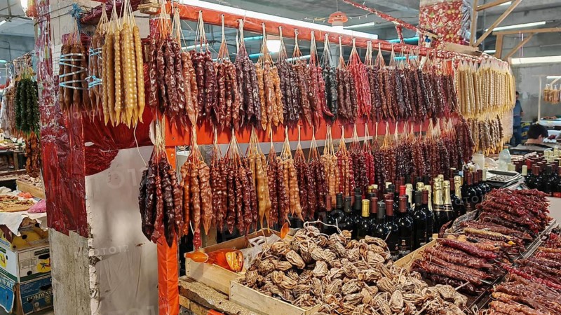 Diverse selection of dried fruits and spices on a market stand, Georgia