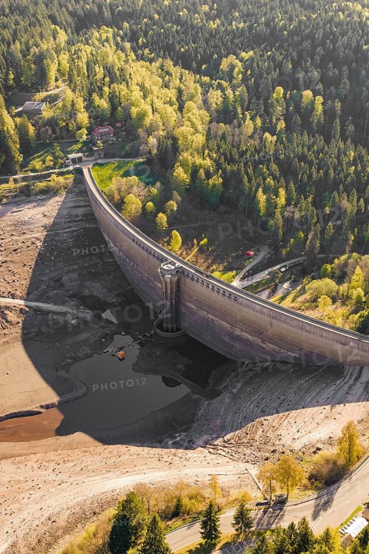 Large dam in a dry landscape, surrounded by forests and hills, emptied Schwarzenbach dam, Forbach, Black Forest, Germany