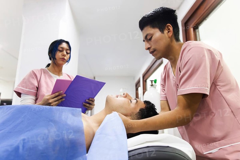 Physiotherapists provide treatment in an Ecuadorian clinic, focusing on rehabilitation and patient care. The team is dedicated to improving health and well-being through therapy