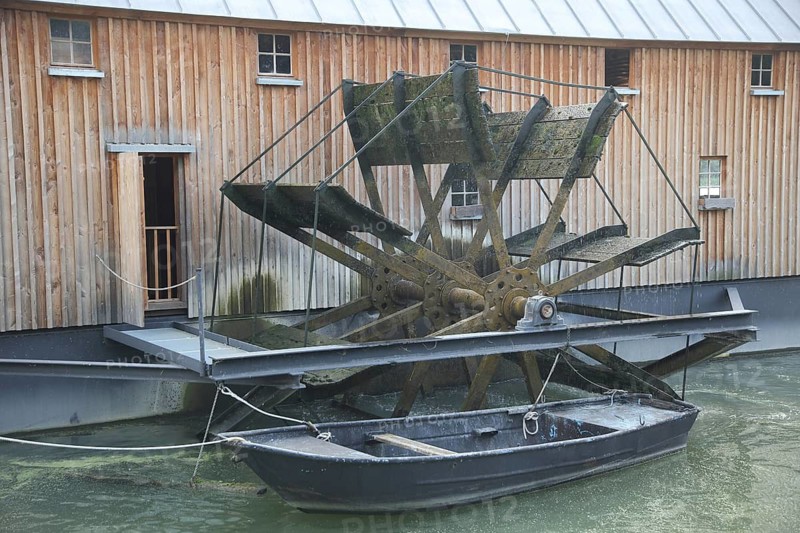 Mill wheel of the historic Rhine ship mill and rowing boat, ship mill, powered by hydropower, water wheel, Rhine, Ginsheim, Hesse, Germany