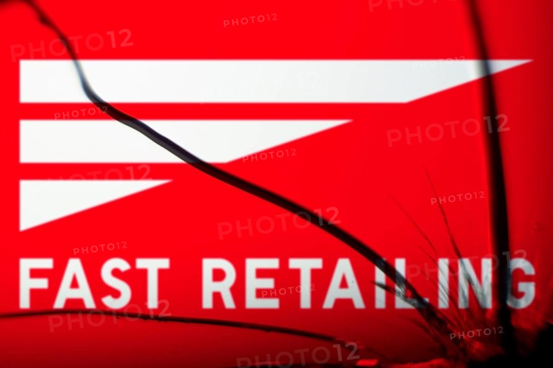 Dhaka, Bangladesh- 28 Nov 2024: Fast Retailing logo is visible on the broken glass. Fast Retailing Co.Ltd. is a public Japanese multinational retail holding company
