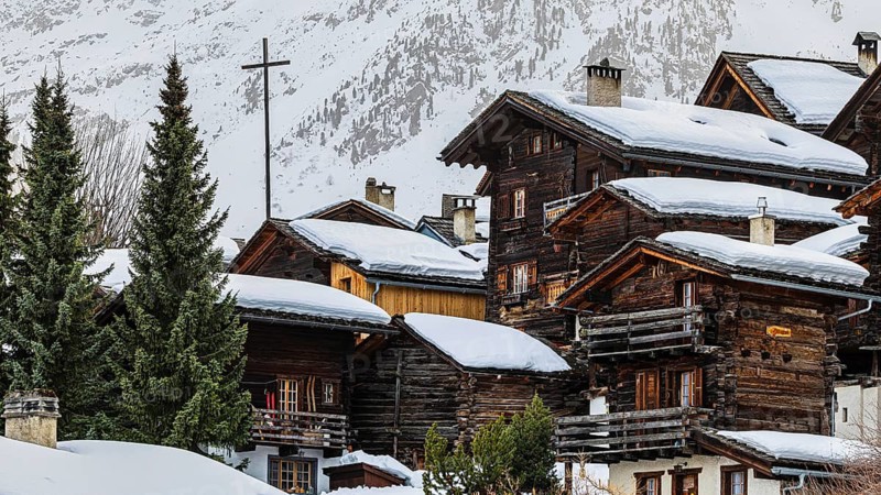 Snow-covered old farmhouses, large wooden cross, historic town center, Grimentz, Val d'Anniviers, Valais Alps, Canton of Valais, Switzerland