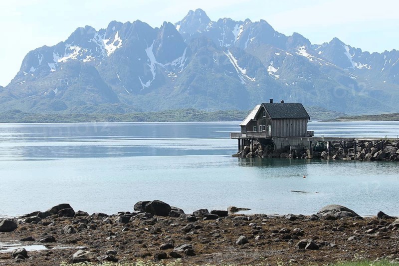 Fishing hut in a fjord in the Lofoten Islands, Norway, Scandinavia